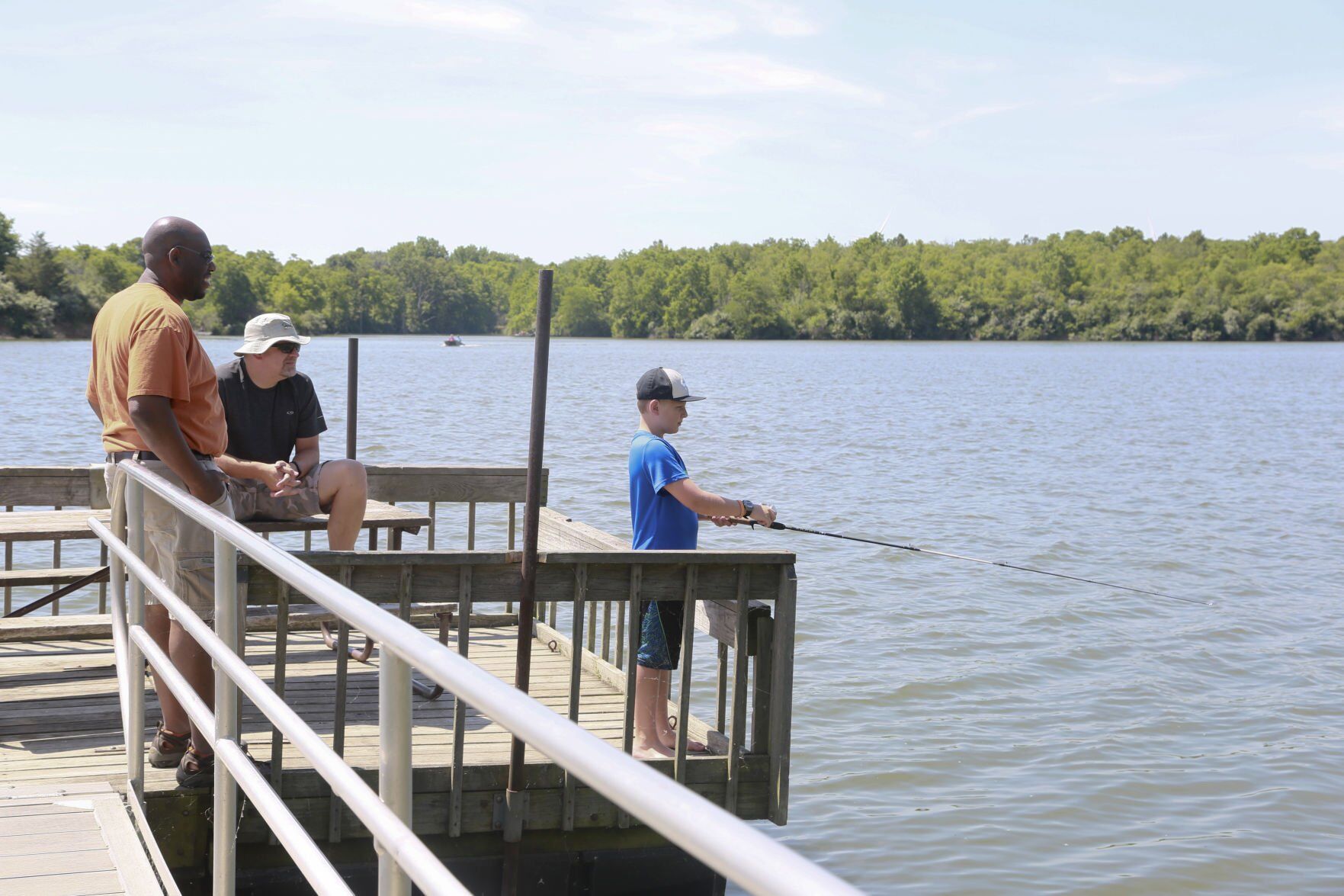 Van Grissom, Gerard Gabbard watch as Seth Gabbard fishes